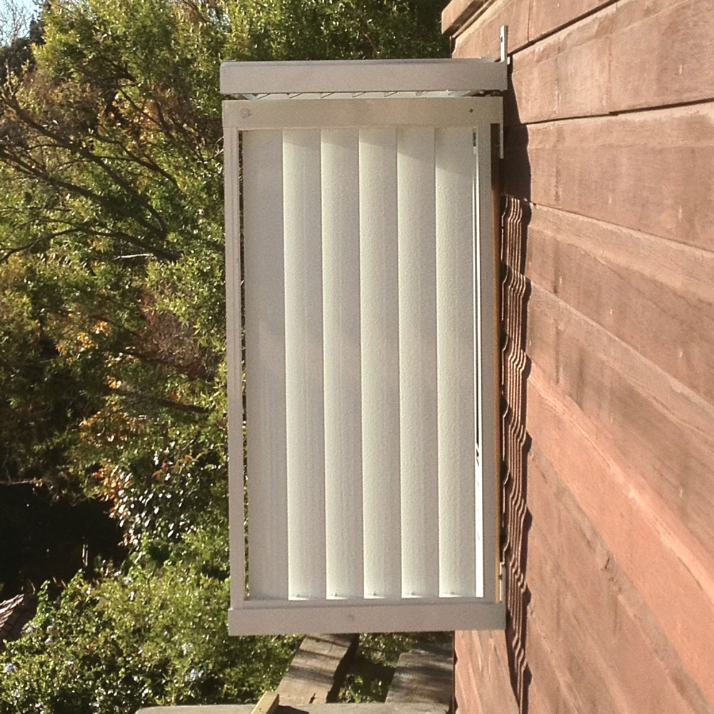 Vertical louvres installed as a privacy screen on the side of a wall.